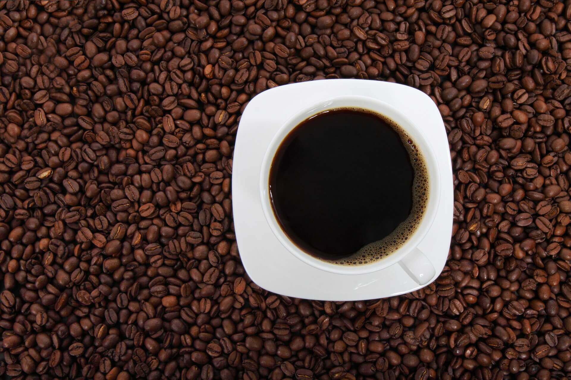 cup of coffee and coffee beans