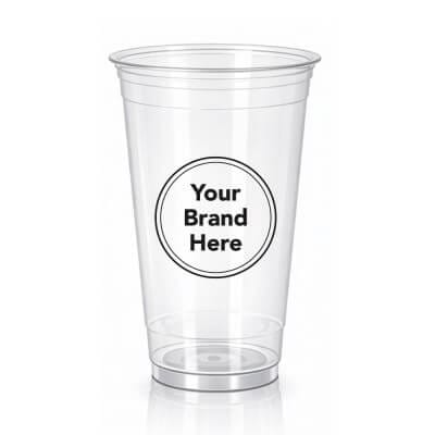 Large 24oz clear PET plastic cold cup featuring a "Your Brand Here" custom logo mockup for iced beverages.